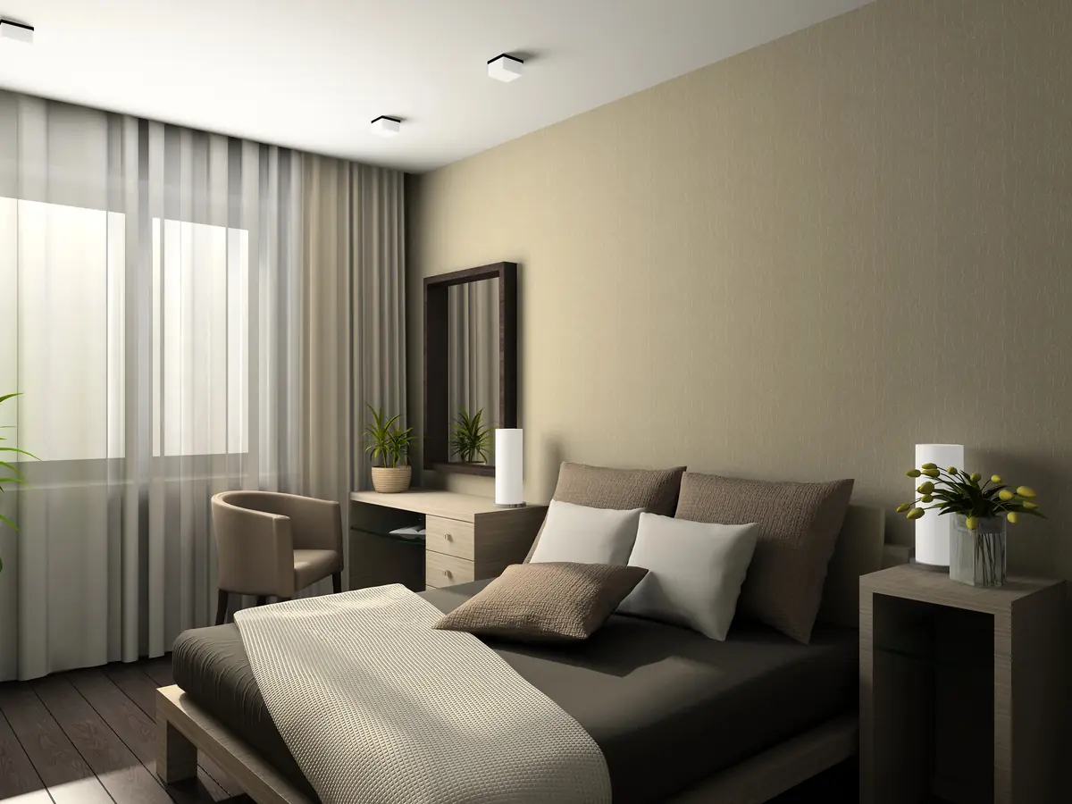 Chambre à coucher rangée avec lit, table de chevet et rideaux